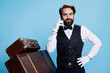 © DC Studio - Hotel porter answer phone call in studio, accepting reservations through telephone line. Professional classy doorkeeper employee having remote chat, booking inquiries and services.