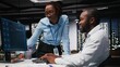 © DC Studio - Team of black IT experts use online AI assistant to automate text generation and solve daily tasks, enhance productivity at the office. Integration of advanced algorithms and digital tools.