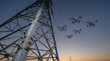 © MaksymFilipchuk - Fleet of inspection drones performs aerial monitoring of a high-voltage transmission tower and power lines at sunset
