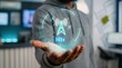 © Malik Hammad  - A person holding a glowing digital telecommunications tower icon representing global wireless connectivity and advanced network technology in a modern professional office