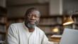 © forenna - Elderly Black professor alone in university library archive after hours, stacks of physical journals surrounding open laptop, frustrated expression, academic publishing paywall barrier, open access