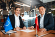 © Valerii Apetroaiei - Diplomatic negotiations between countries in the office