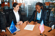 © Valerii Apetroaiei - Diplomatic negotiations between countries in the office