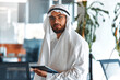 © Valerii Apetroaiei - Arab male businessman in office