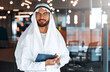 © Valerii Apetroaiei - Arab male businessman in office