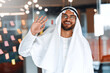 © Valerii Apetroaiei - Arab male businessman in office