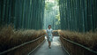 © bephoto - 朝の竹林をゆっくり歩く日本人女性の爽やかな散策風景写真