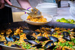 © Austockphoto - Close up of serving Paella with mussels