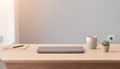 © Ersa - A modern desk setup with a laptop and coffee cup in soft natural light. The minimal layout creates a relaxed and productive working environment.
