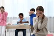 © New Africa - Girl getting bullied by her classmates in classroom, selective focus