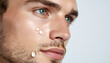 © hana22 - Close-up portrait of a young man's face with clear water drops and serum dripping down his cheek, fresh hydrated skin texture with stubble, men's skincare and hydration concept with copy space