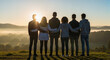 © Татьяна Кондратенко - Group of young friends standing together silhouetted at sunrise