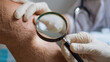 © Lemonkey - Close up of doctor examining patient knee with magnifying glass during consultation, representing healthcare, diagnosis, dermatology, rehabilitation, and medical treatment.