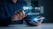 © MopoWe - AI SEO digital interface glows above a smartphone as a professional optimizes search results using artificial intelligence. This image is ideal for corporate technology presentations.