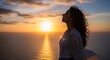 © momoka - 広がる海と空が織りなす夕焼けの絶景を背景に立つ女性の横顔 輝く黄金色の夕日を全身で浴び髪も美しく輝く深く感動的な瞬間 穏やかな表情が静かな安らぎと自由を伝える. AI Generated