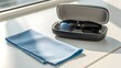 © ATA - Sunglasses Cleaning Cloth Neatly Folded Beside A Lens Box Under Bright Lighting Creating A Minimalist Clean Scene Of Daily Eyewear Care Fashion Accessory And Modern Lifestyle Detail