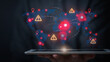 © Piya W. - Serious businessman holding tablet showing global distribution network map with warning sign highlighting danger and urgent risk level