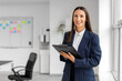 © Pixel-Shot - Female business consultant with clipboard in office