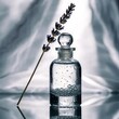 © Nowshad - A clear perfume bottle with lavender sprig and bubbles on a reflective surface indoors.
