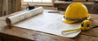 © SIMANG - Architectural blueprints, safety helmet, and tape measure on a wooden worktable with natural lighting
