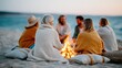 © Pinklife - A group of friends enjoys a cozy evening around a bonfire on the beach, sharing laughter, warmth, and creating lasting memories under a beautiful sunset.