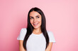 © deagreez - Young smiling woman in white t-shirt looking up against a pink background, cheerful portrait conveying happiness, optimism and playful modern lifestyle