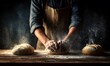 © Mia - hands of baker's male knead dough