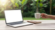 © Genowefa - Remote work lifestyle in morning sunlight with laptop on outdoor wooden desk, hand reaching for coffee cup, balanced productivity and mindful break in natural garden workspace environment