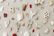 © yrabota - Minimal nautical pattern with natural coral stones and seashells on warm sandy surface, aesthetic natural organic seaside texture, beach vibes for spa interiors, wellness branding, neutral tones.