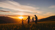 © AhsannCreative - Happy family of four enjoying a picturesque evening run through a vast, open field, silhouetted by a breathtaking mountain sunset, embodying love, freedom, and the joy of togetherness