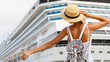 © nikolas_jkd - Woman tourist standing in front of big cruise liner, travel female