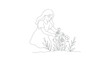 © Sarang - Woman picking flowers in the garden.