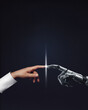 © Igor Link - White cyborg robotic hand pointing his finger to human hand with stretched finger on blue night sky with stars - cyber la creation. Poster with copy space.