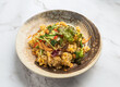 © Food Shop - Delicious bowl of mixed rice salad with vegetables and herbs on a marble surface