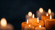 © Roydo - Group of Burning Candles in the Dark for World Refugee Day Vigil, Symbolizing Memorial Hope and Remembrance for Displaced People and Humanitarian Crisis Victims in Warm Ambient Light