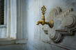 © MICHEL - Antique brass faucet on ablution fountain in Ottoman mosque, Istanbul, Turkey