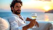 © EBG Stock Studio - Hombre elegante tomando vino blanco frente al mar al atardecer en ambiente de lujo y relax