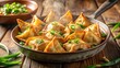 © Kitiphong - A photo of crispy fried wontons filled with savory chicken and green scallions, steaming hot from the pan