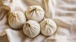 © Vaundy - acupressure. Herbal massage balls arranged on a cloth, spa-like setting. lifestyle magazines, social media lookbooks, designed for lifestyle magazines and social media content, drives engagement.