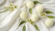 © Vaundy - acupressure. Herbal massage balls arranged on a cloth, spa-like setting. lifestyle magazines, social media lookbooks, designed for lifestyle magazines and social media content, drives engagement.