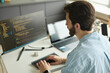 © Westend61 - Programmer coding on computer in the office