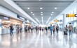 © PRI - Blurred View of a Busy Airport Terminal with a Counter in the Foreground