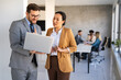 © NDABCREATIVITY - Portrait of successful multicultural business team working in corporate business office