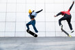 © VISTA by Westend61 - Skateboarders performing synchronized trick outdoors in Barcelona