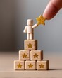 © Yuparet - Customer Loyalty and Satisfaction Survey Concept with Wooden Figurine Touching Golden Star Icon
