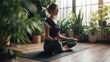 © Marvel’s Nook - Woman practicing yoga meditation at home in bright living room, peaceful wellness routine, mindfulness and healthy lifestyle concept