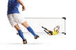 © Ljupco Smokovski - Football player taking a shot at a goal and a goalkeeper making a save