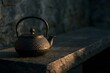 © Novita - Cast Iron Teapot on Rustic Stone Bench
