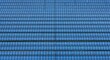 © Paul - Symmetrical overhead view of a vast solar power plant with blue panels arranged in perfect rows creating a repeating geometric pattern, power, field, infrastructure