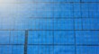 © Paul - Top down perspective of expansive photovoltaic power station grids forming a minimalist architectural abstraction with repeated blue panels, geometry, module, repetition